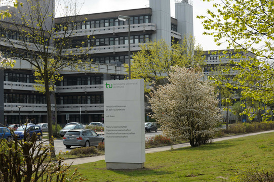 The building Emil-Figge-Straße 50 with a signpost in the foreground.